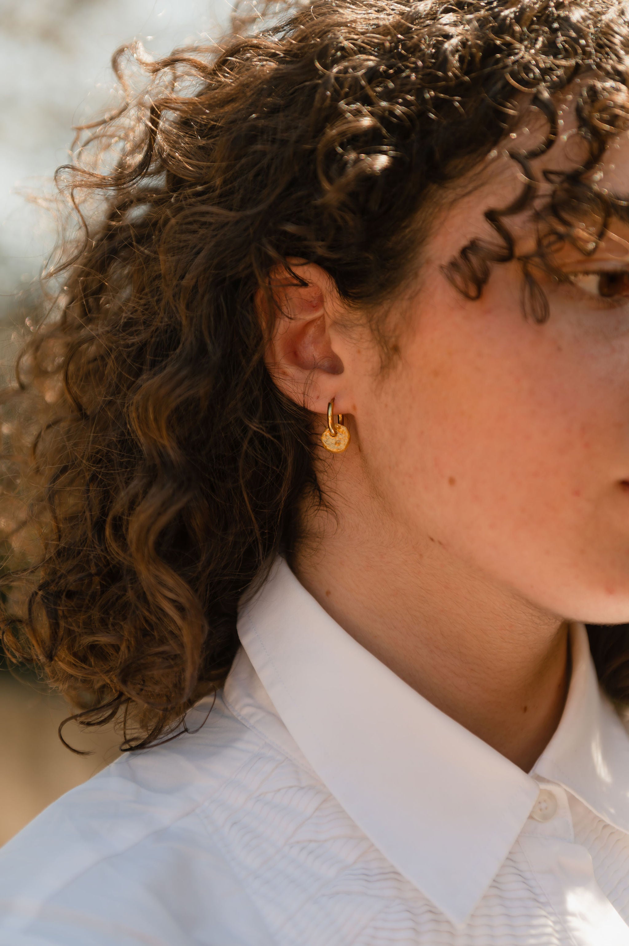 Aster gold hoop with model lifestyle minimalist classic single earrings and pair