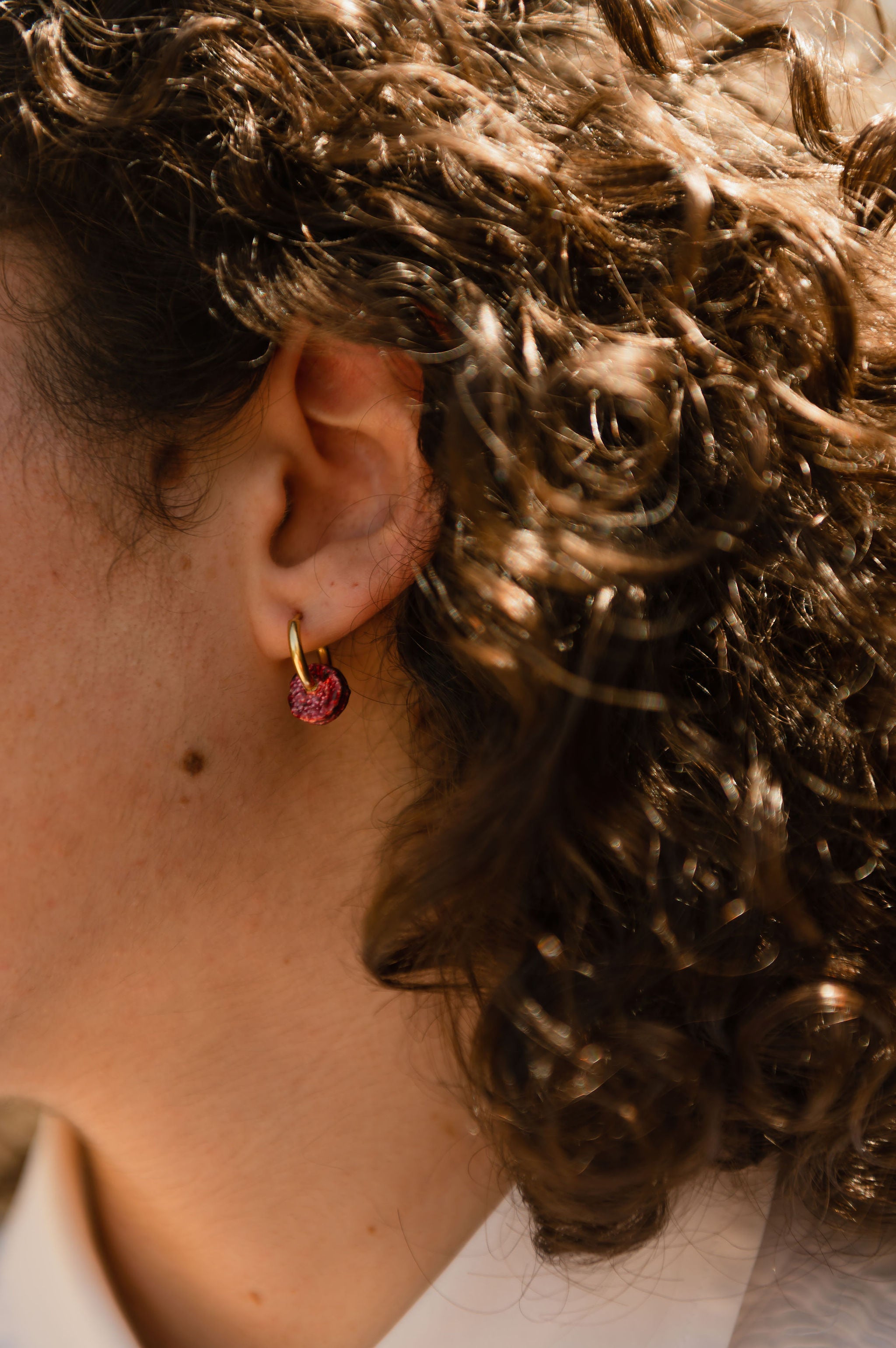 Coquelicot Tiny Hoop - single earring on model lifetyle