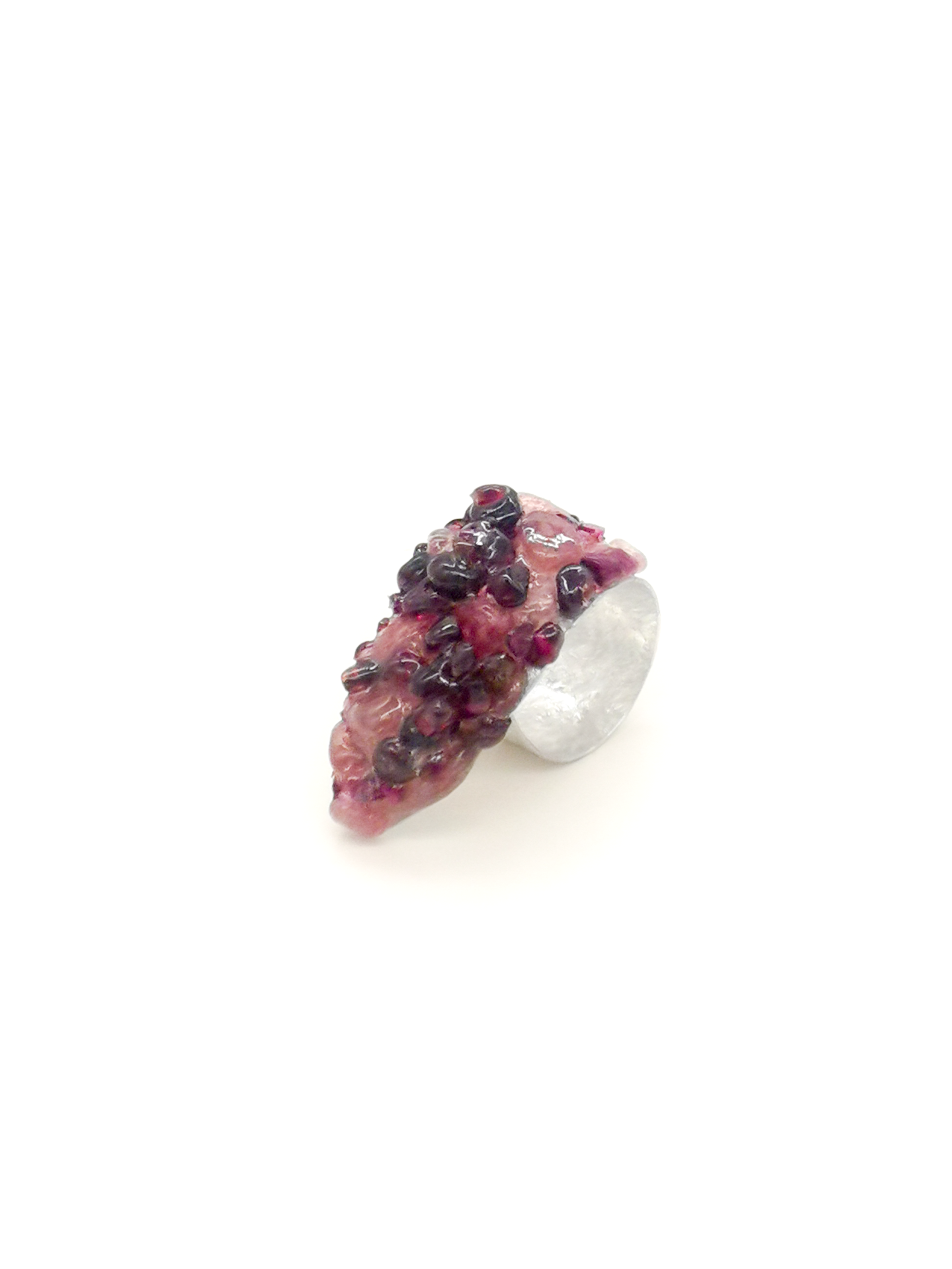 Ring with purple gemstones on a white background
