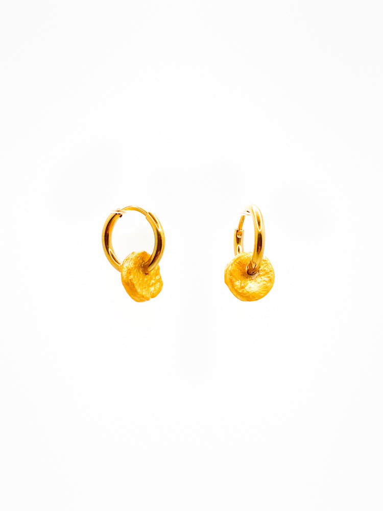Tiny hoops gold Aster orange skin front organic jewelry