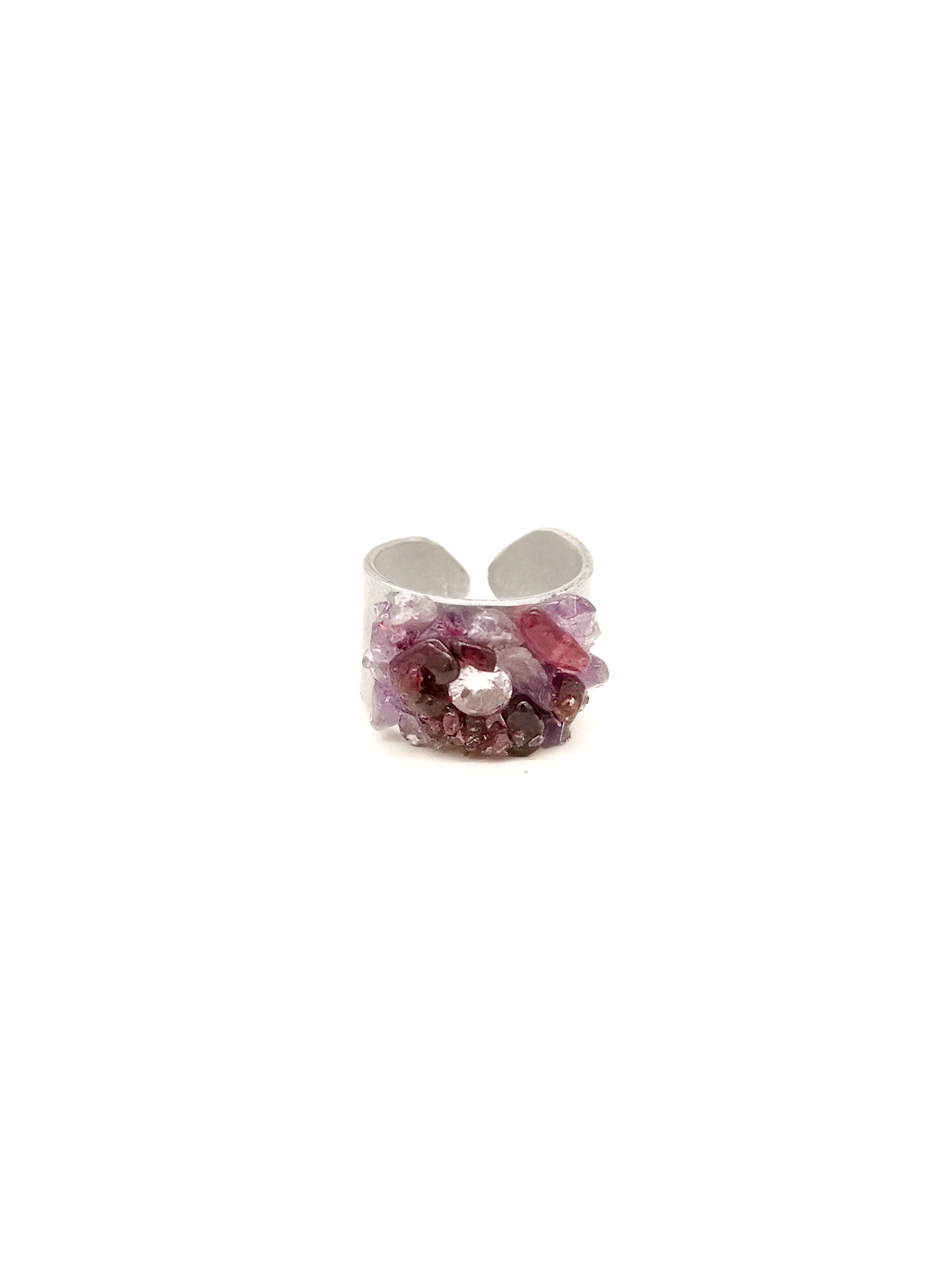 Silver ring with purple gemstone on a white background